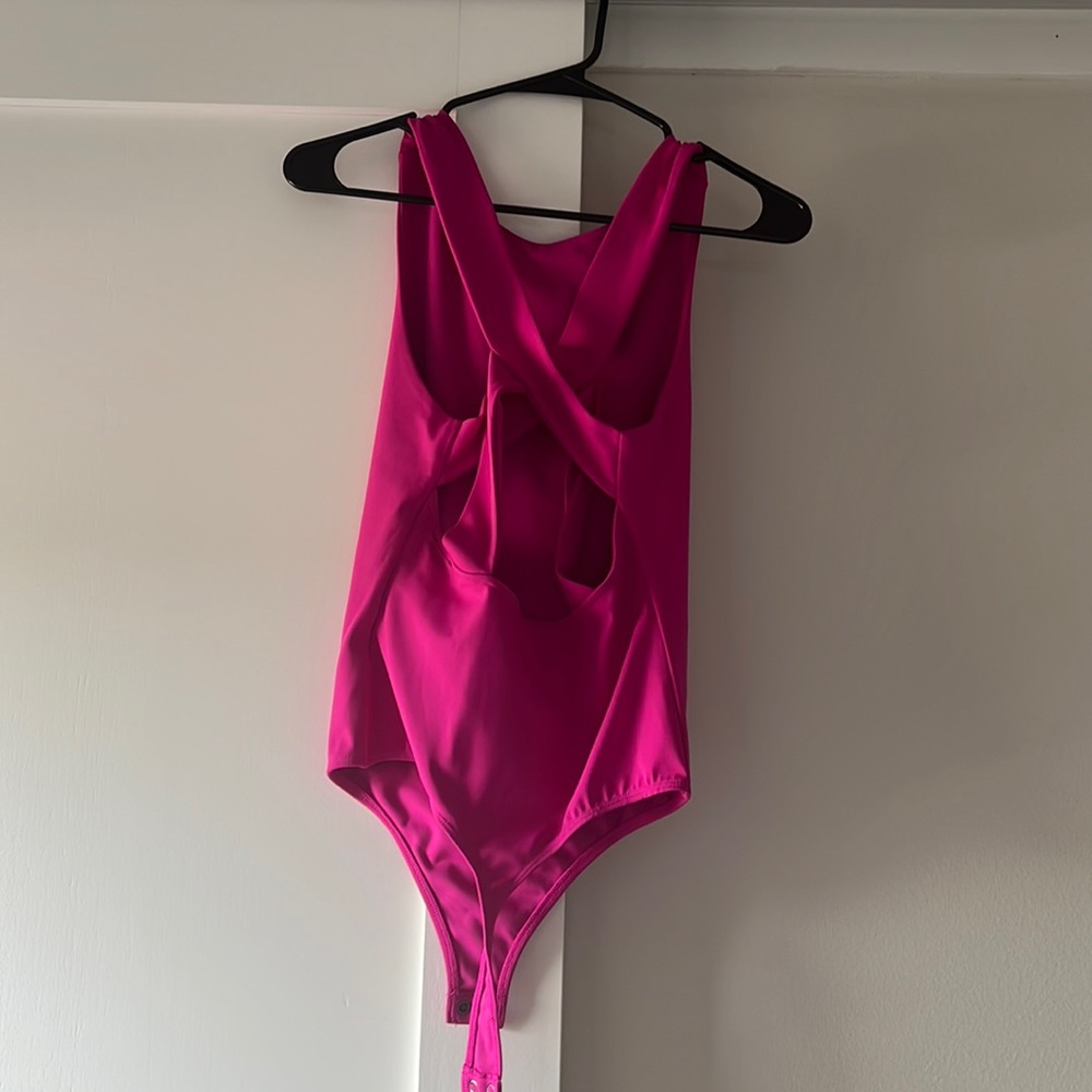 Pink open back cross bodysuit